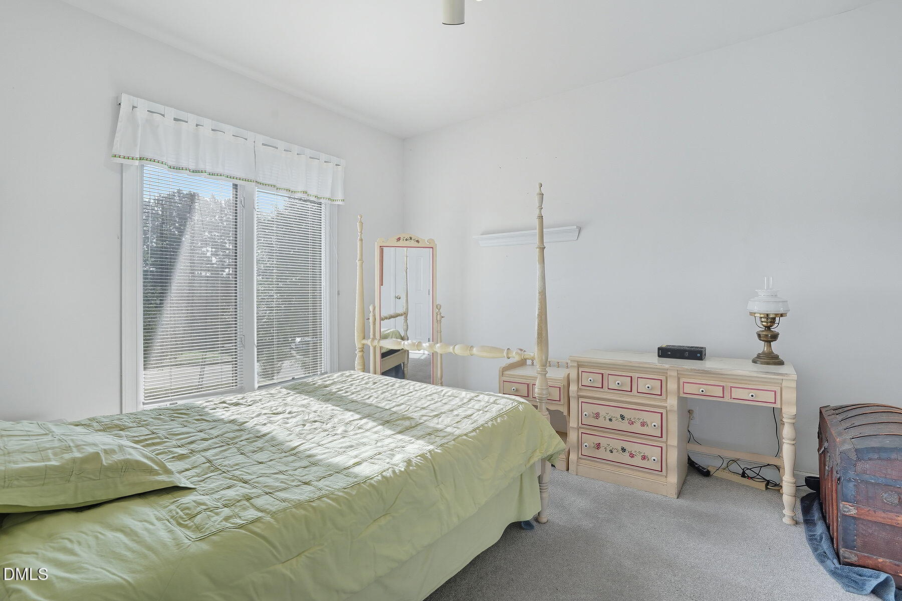 2029 Castle Pines Drive Raleigh, NC 27604 - Photo 26 of 38 a bedroom with a bed table and a chair