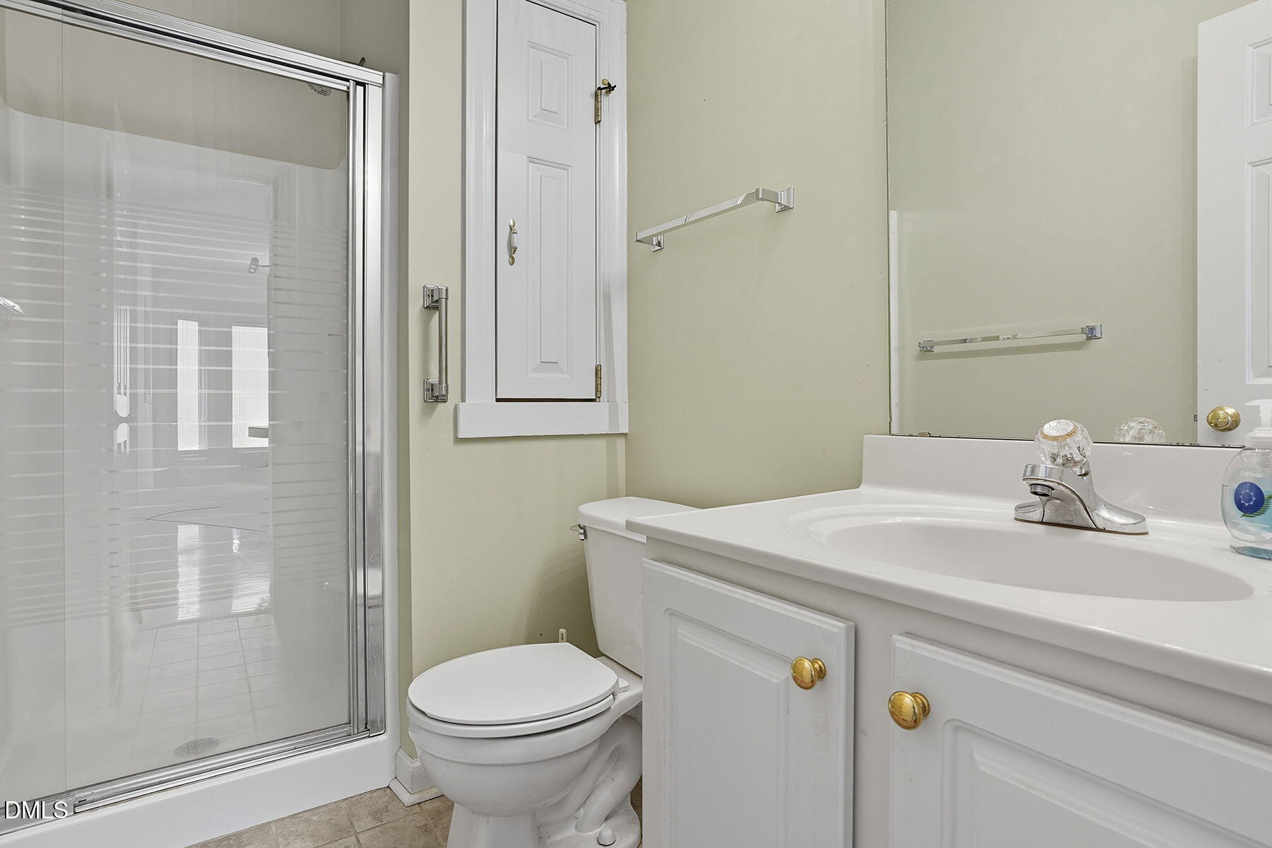 2029 Castle Pines Drive Raleigh, NC 27604 - Photo 27 of 38 a bathroom with a sink toilet and shower