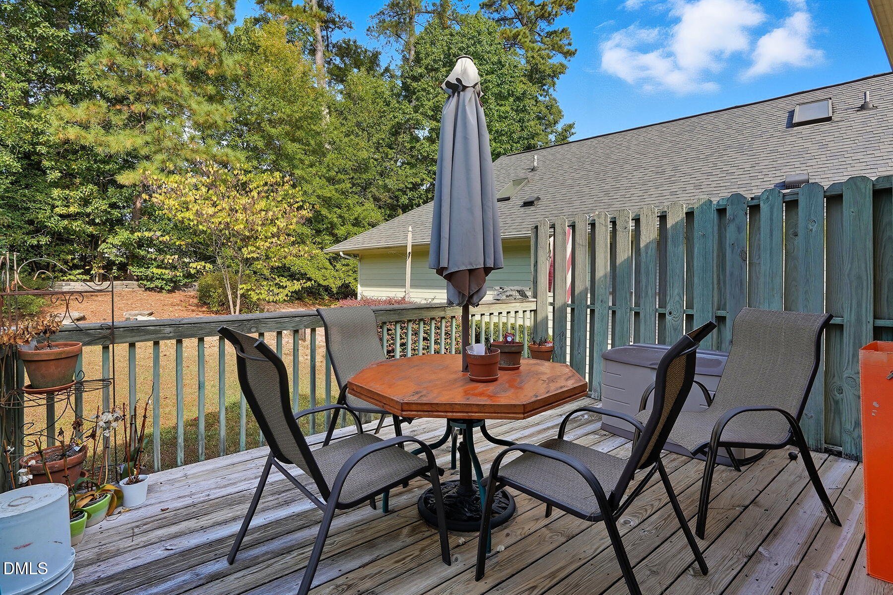 2029 Castle Pines Drive Raleigh, NC 27604 - Photo 28 of 38 a balcony with wooden floor table and chairs