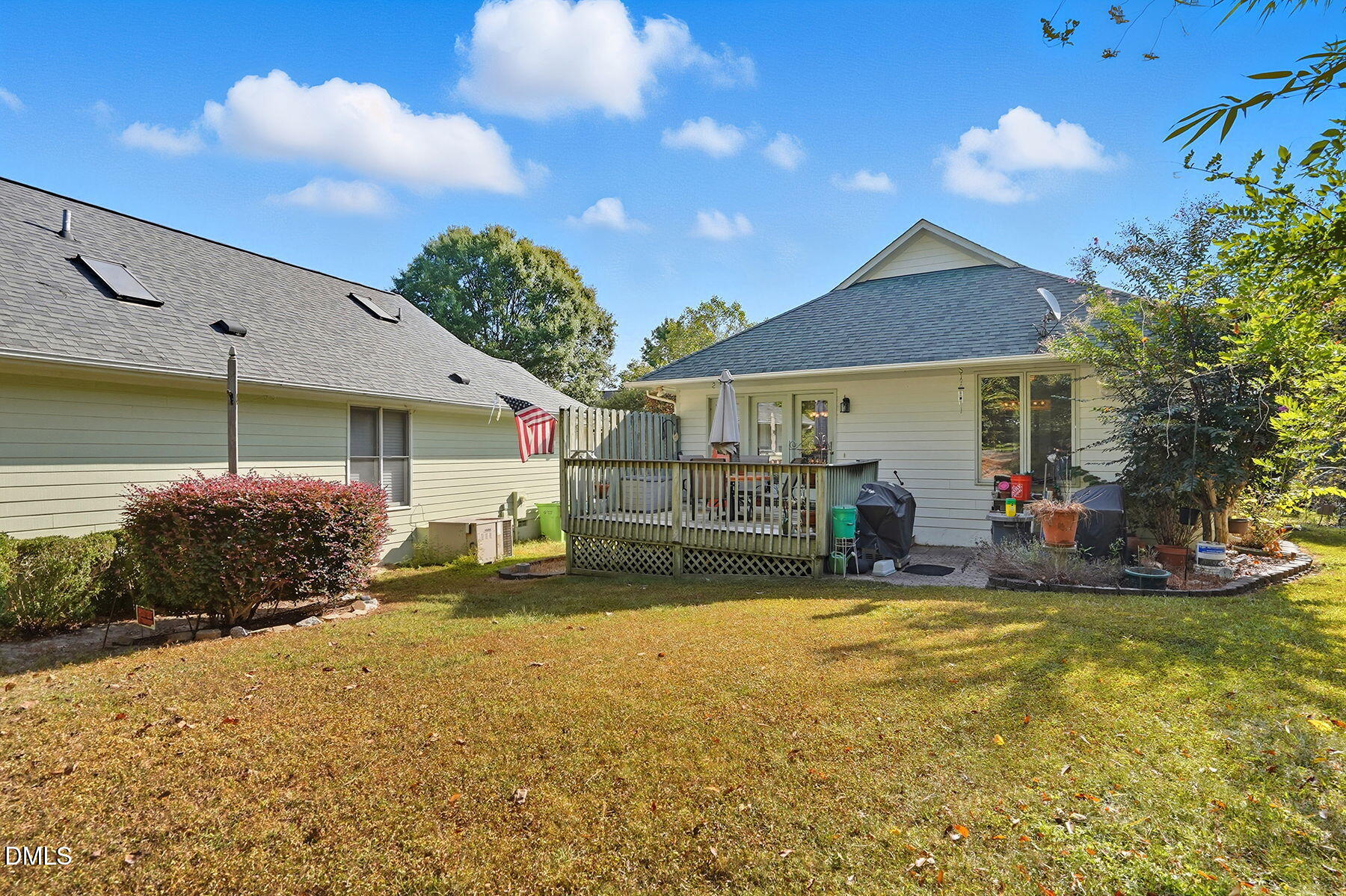 2029 Castle Pines Drive Raleigh, NC 27604 - Photo 29 of 38 a view of a house with floor to ceiling windows and a yard