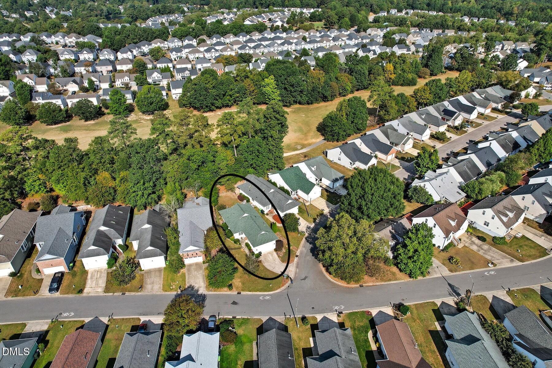 2029 Castle Pines Drive Raleigh, NC 27604 - Photo 32 of 38 an aerial view of residential houses with outdoor space
