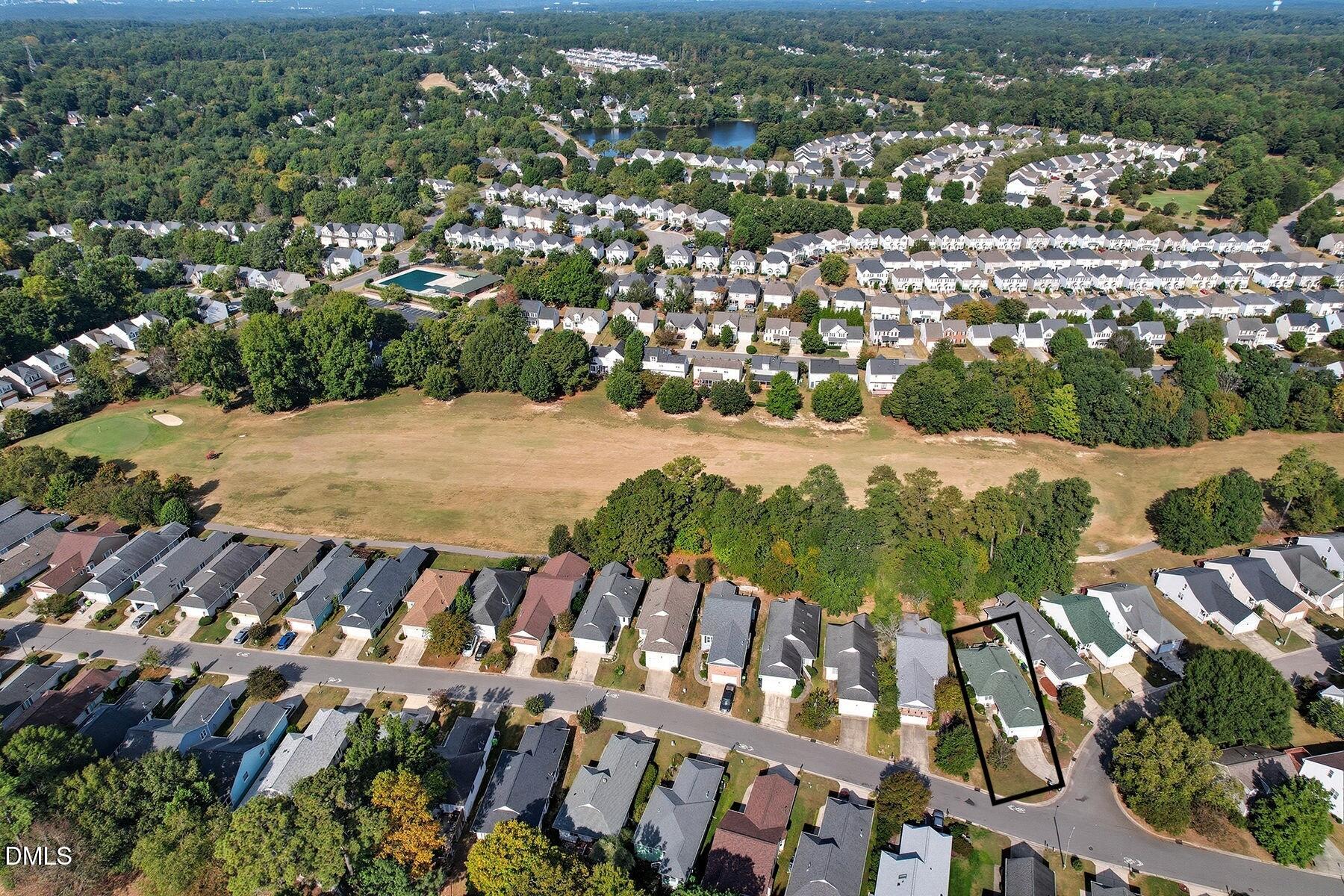 2029 Castle Pines Drive Raleigh, NC 27604 - Photo 36 of 38 an aerial view of residential houses with outdoor space