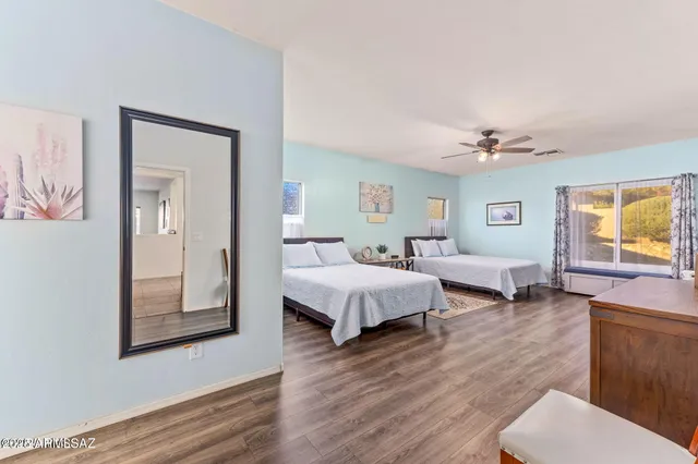 a spacious bedroom with a bed and a couch