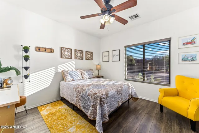 a bedroom with a bed and a couch