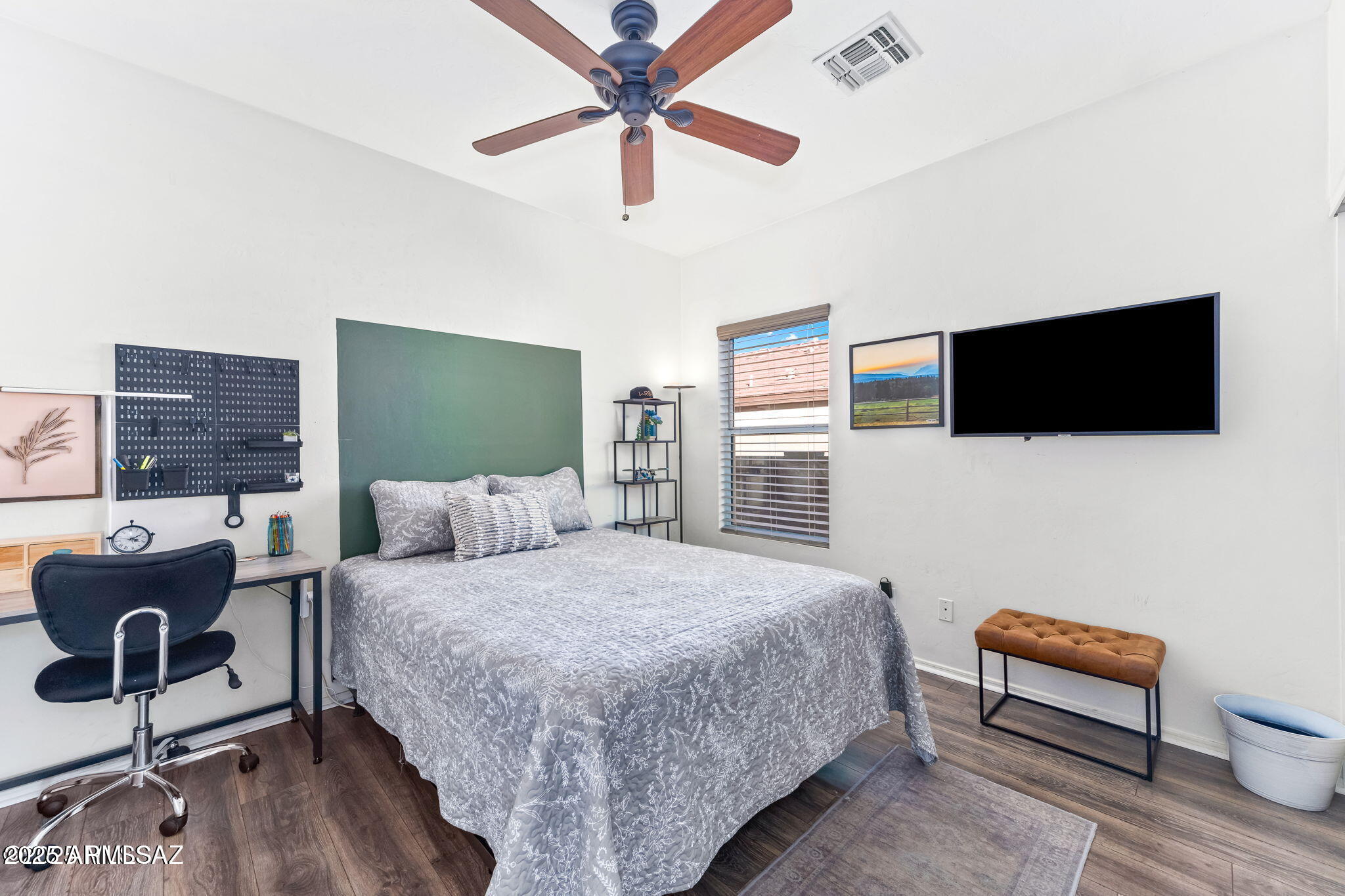 3635 East Secretariat Road Tucson, AZ 85739 - Photo 17 of 27 a bedroom with a bed and a flat screen tv