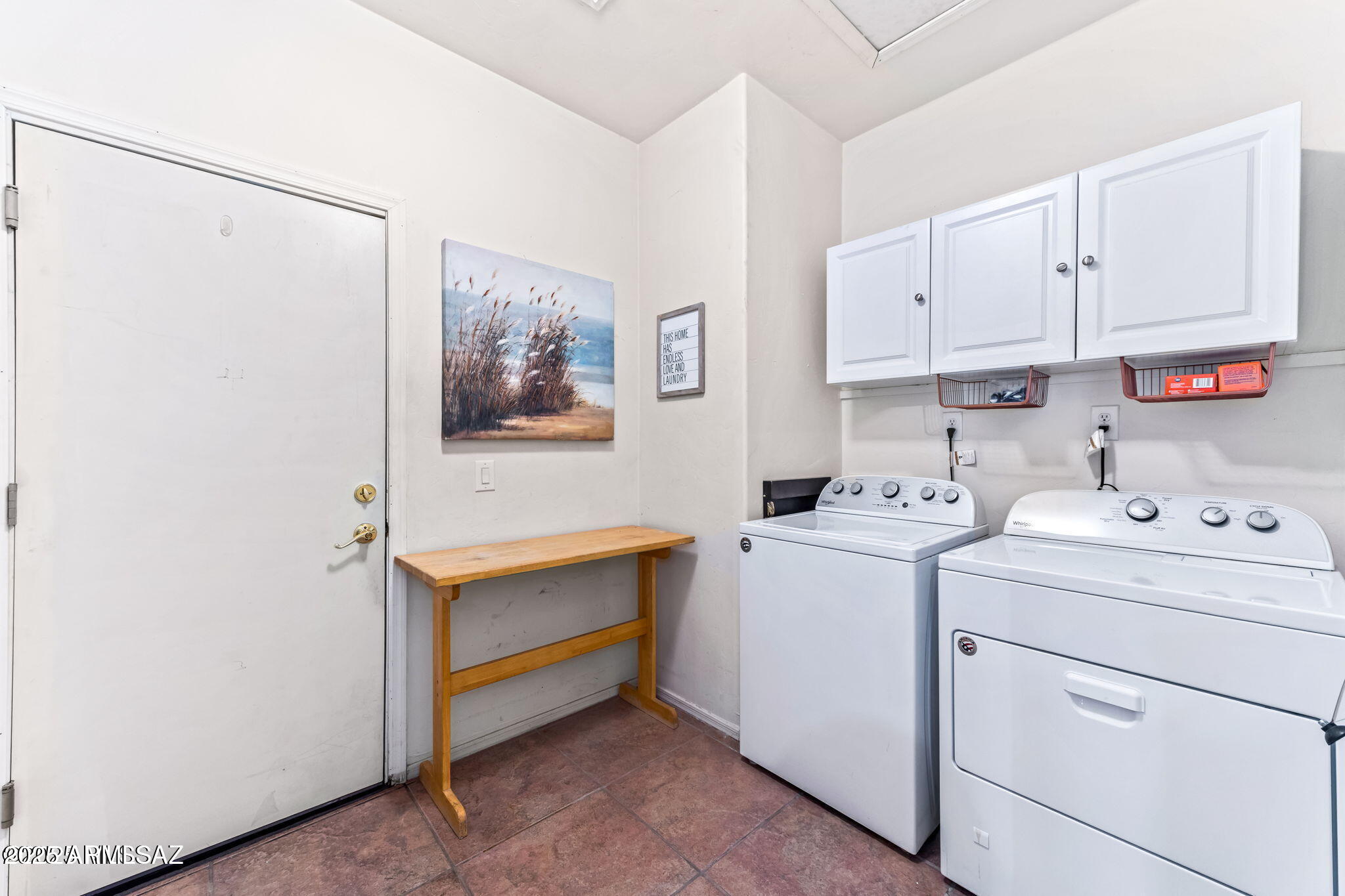 3635 East Secretariat Road Tucson, AZ 85739 - Photo 18 of 27 a view of storage and utility room with washer and dryer