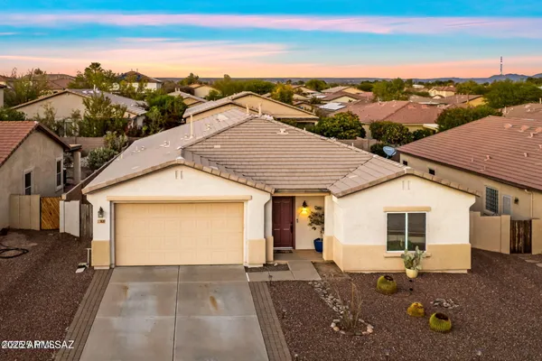 an aerial view of a house with a yard