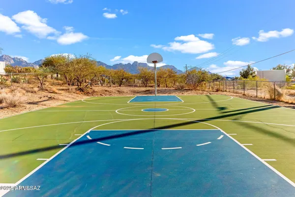 a view of an outdoor space and tennis court