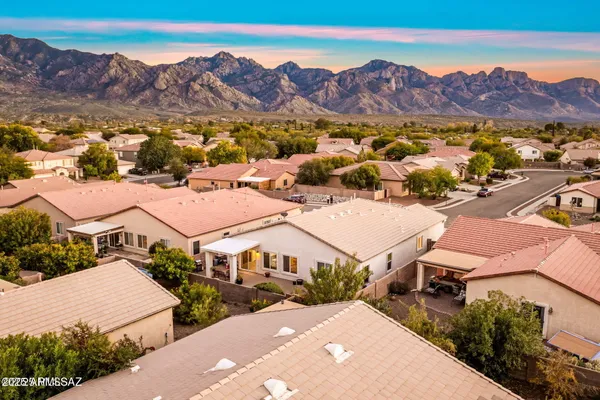a view of a city with mountains in the background
