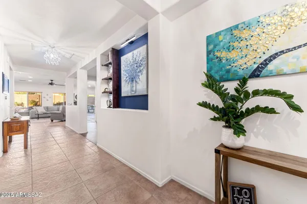 a view of a hallway with a potted plant