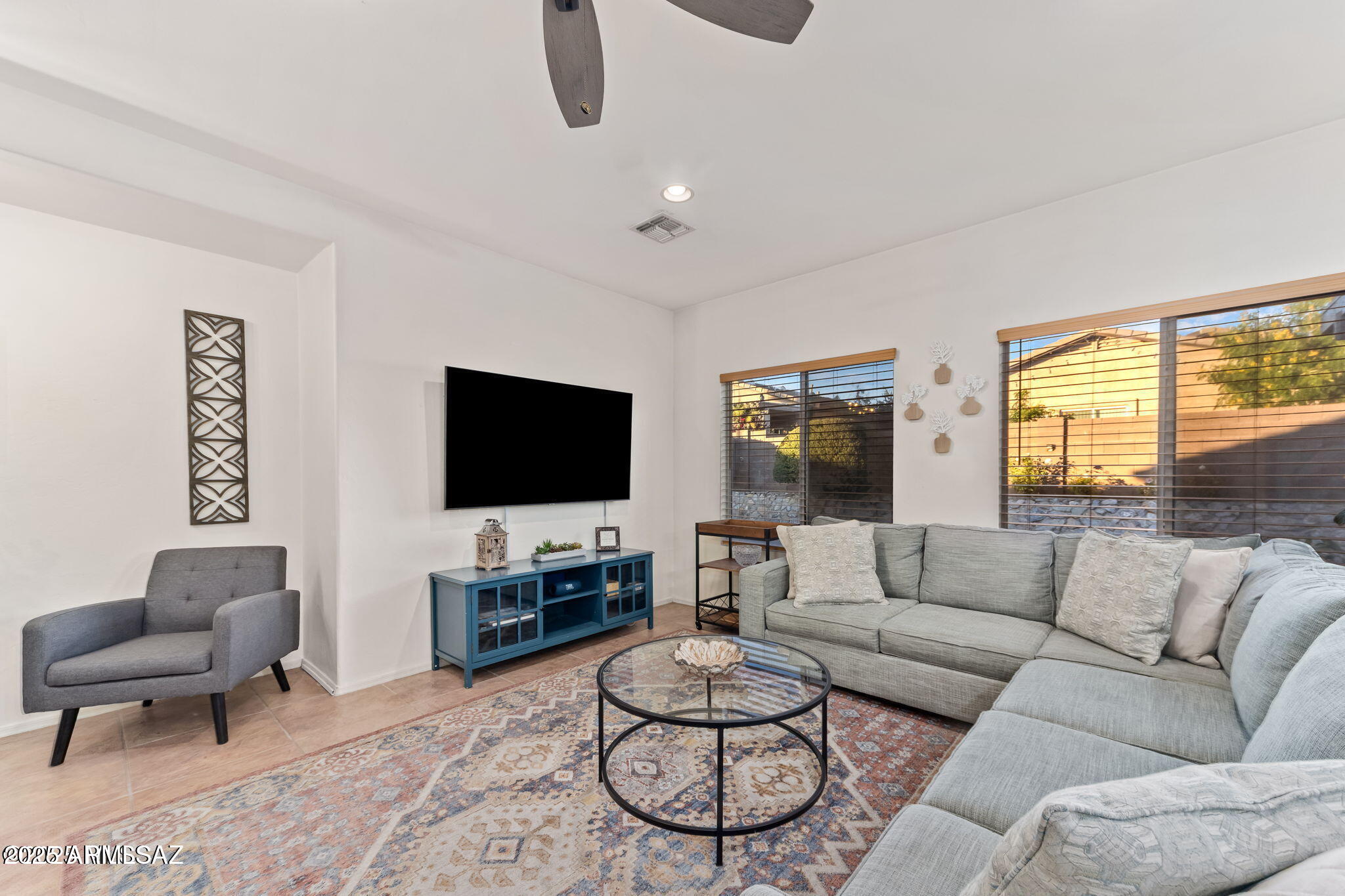 3635 East Secretariat Road Tucson, AZ 85739 - Photo 5 of 27 a living room with furniture and a flat screen tv