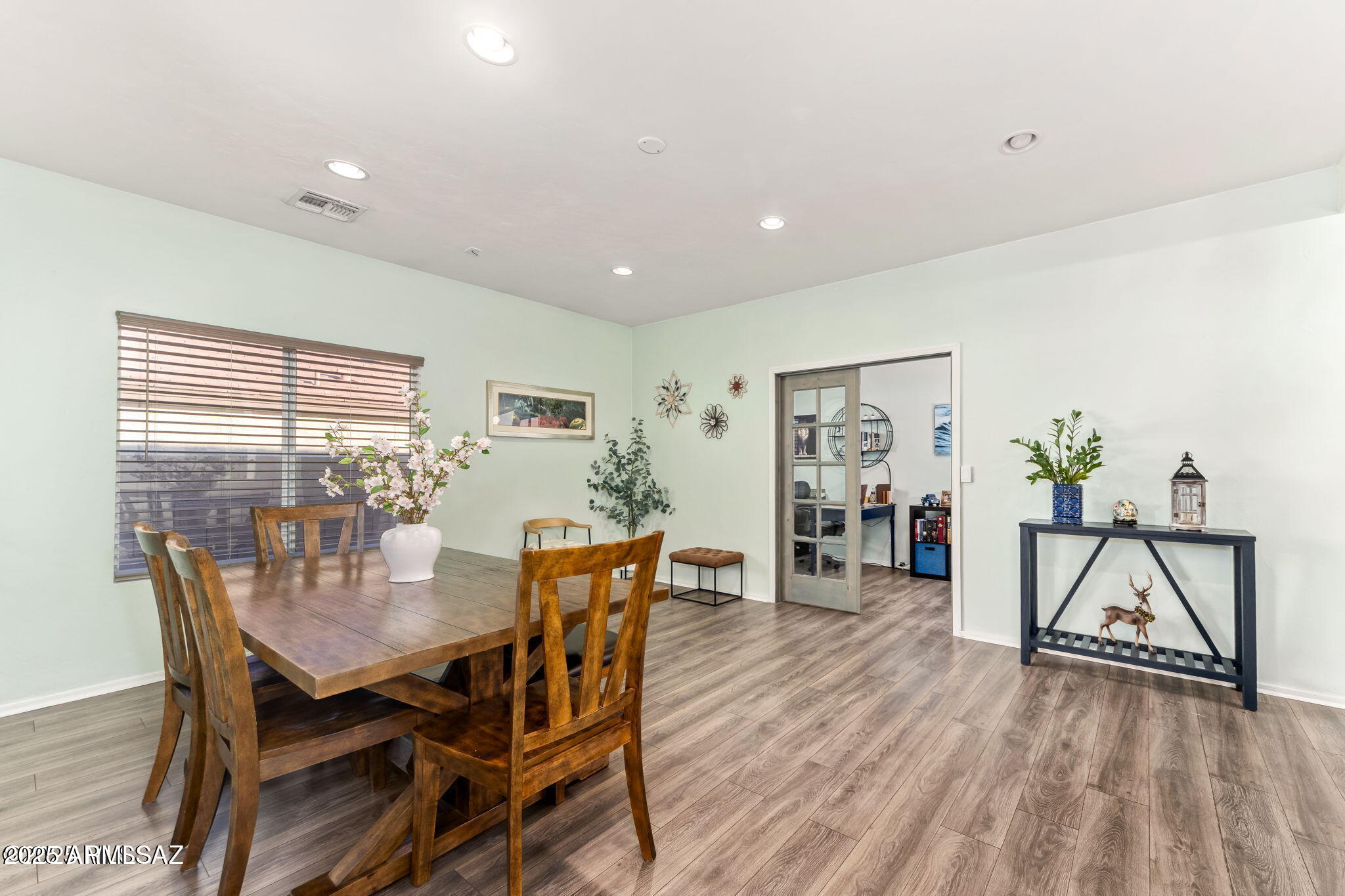 3635 East Secretariat Road Tucson, AZ 85739 - Photo 9 of 27 a view of a dining room with furniture and wooden floor