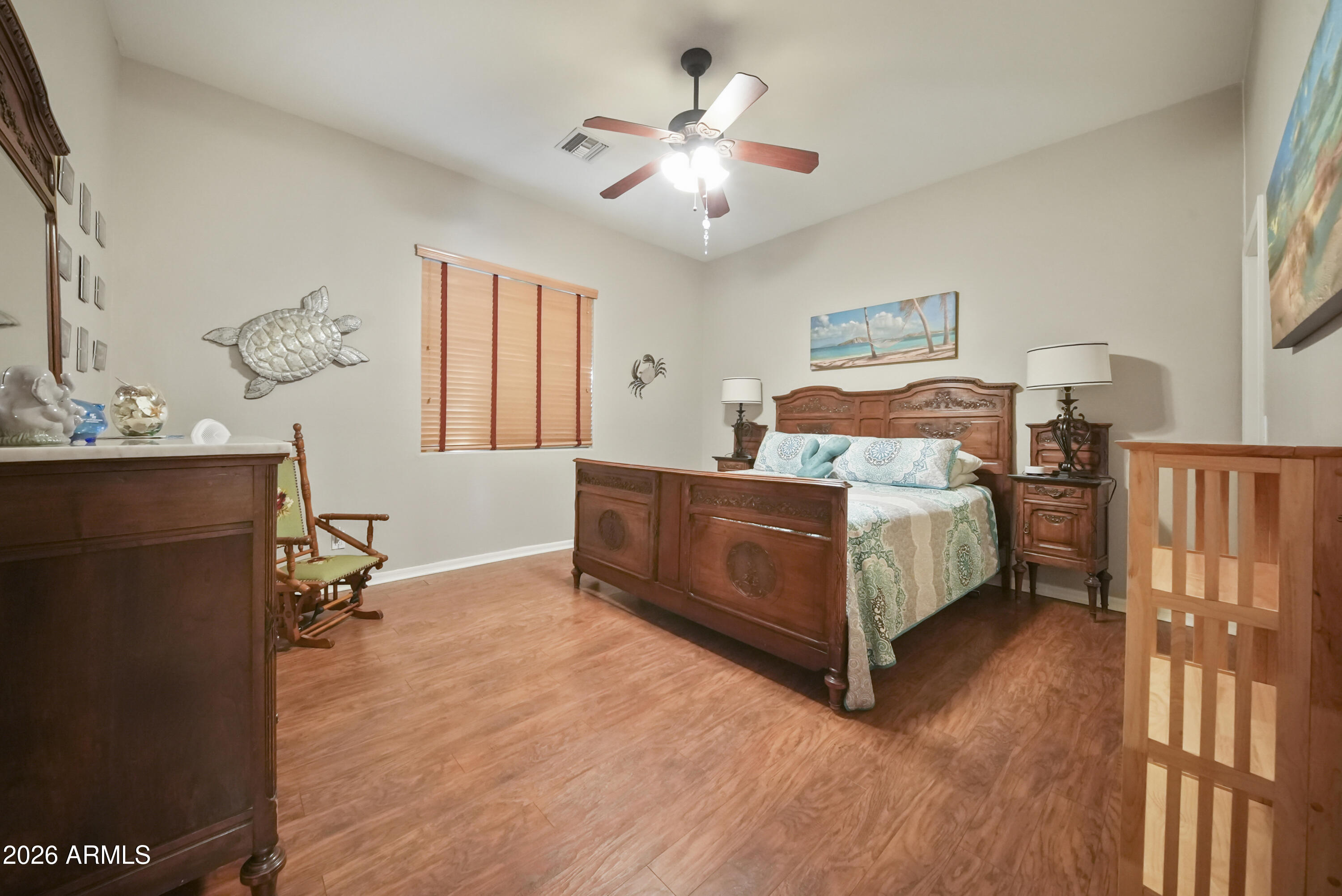 605 West Ridgecrest Road Phoenix, AZ 85086 - Photo 30 of 40 a bedroom with a bed and a chandelier