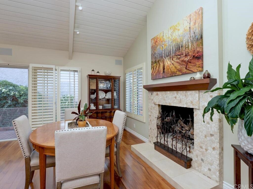 7 Sunridge Irvine, CA 92604 - Photo 19 of 66 a living room with furniture a fireplace and a large window