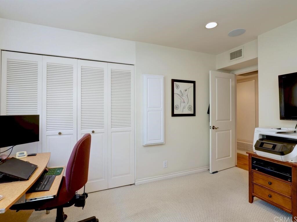 7 Sunridge Irvine, CA 92604 - Photo 23 of 66 a view of a workspace with furniture and a flat screen tv