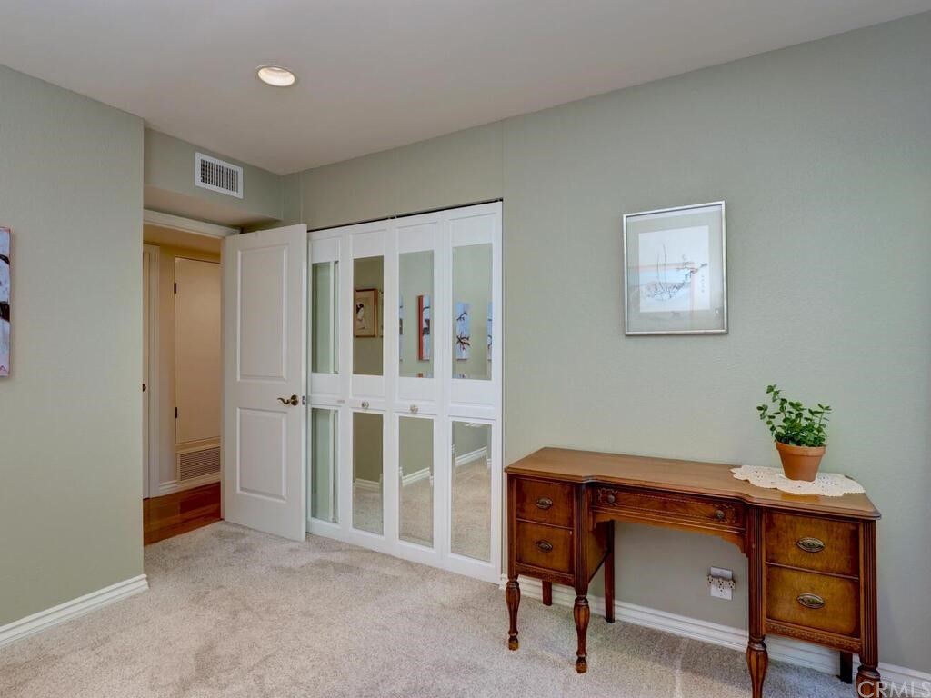 7 Sunridge Irvine, CA 92604 - Photo 26 of 66 a room that has a dresser and a chair in it