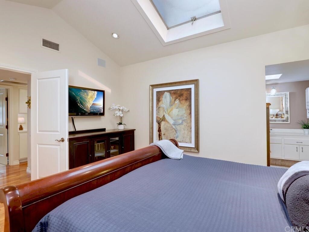 7 Sunridge Irvine, CA 92604 - Photo 30 of 66 a bedroom with furniture and a flat screen tv