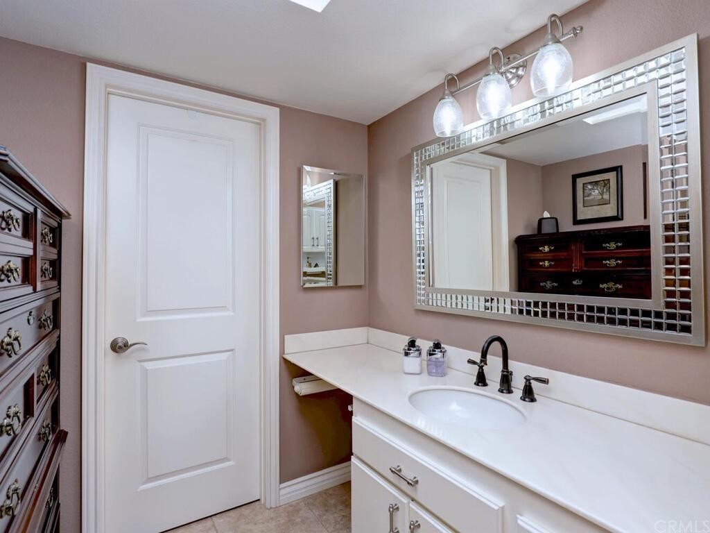 7 Sunridge Irvine, CA 92604 - Photo 31 of 66 a bathroom with a sink double vanity and a mirror