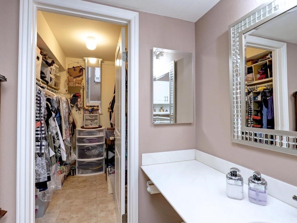 7 Sunridge Irvine, CA 92604 - Photo 32 of 66 a view of a bathroom with a sink and a mirror