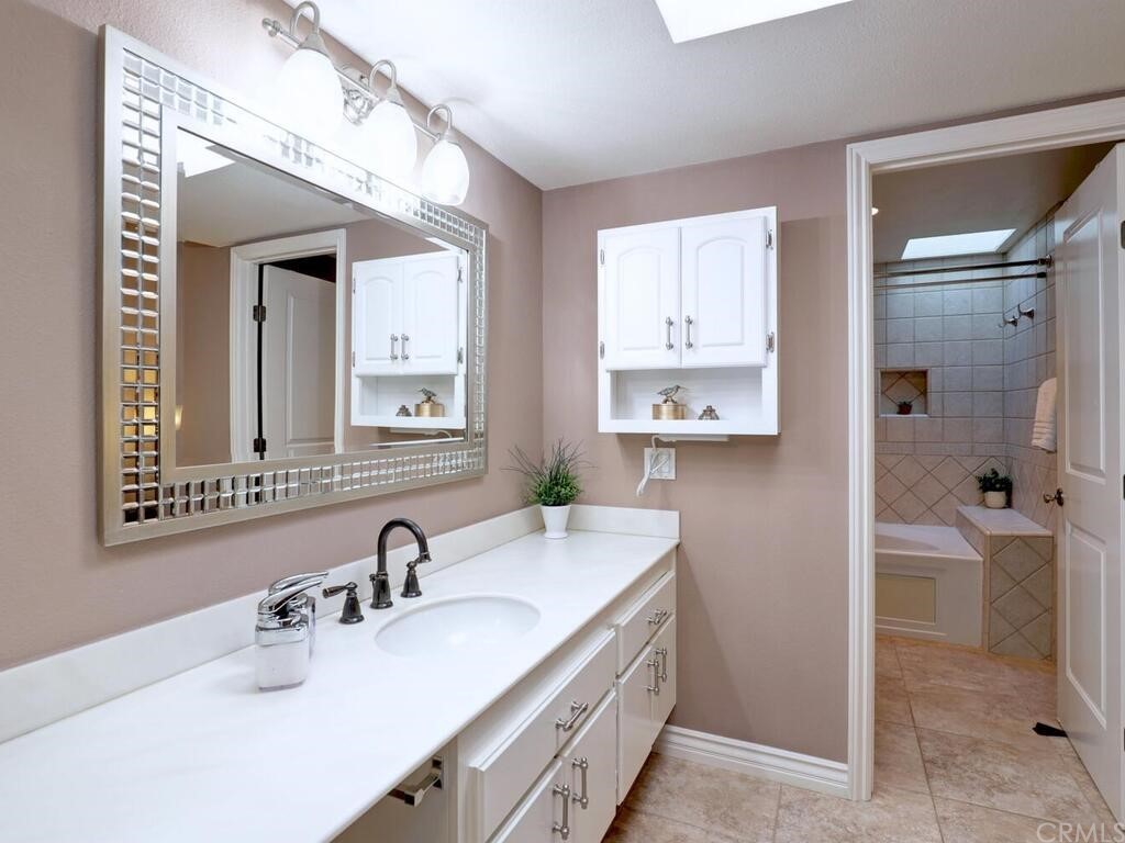 7 Sunridge Irvine, CA 92604 - Photo 33 of 66 a bathroom with a sink and a mirror
