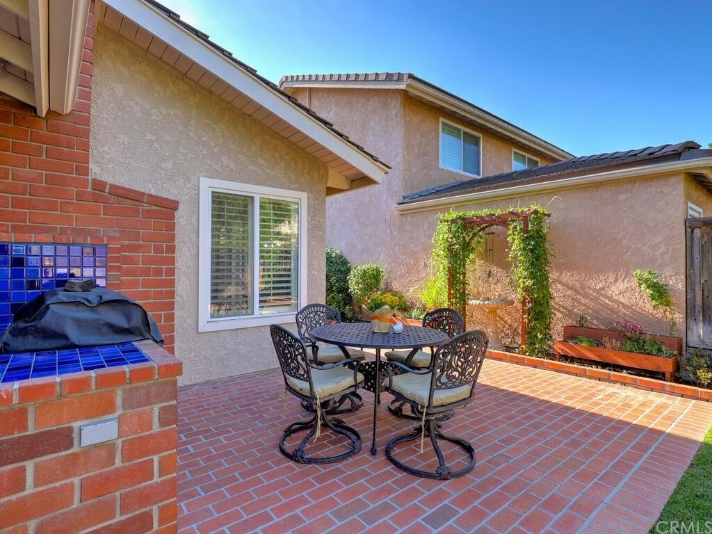 7 Sunridge Irvine, CA 92604 - Photo 40 of 66 a view of a patio with table and chairs and potted plants
