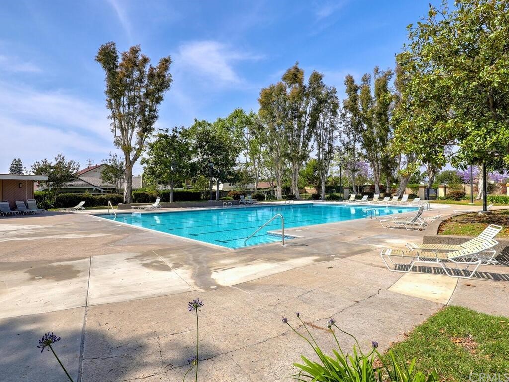 7 Sunridge Irvine, CA 92604 - Photo 43 of 66 a view of a swimming pool with a yard