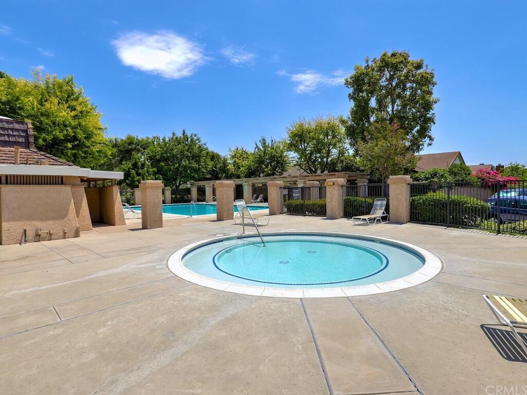7 Sunridge Irvine, CA 92604 - Photo 60 of 66 a backyard of a house with table and chairs