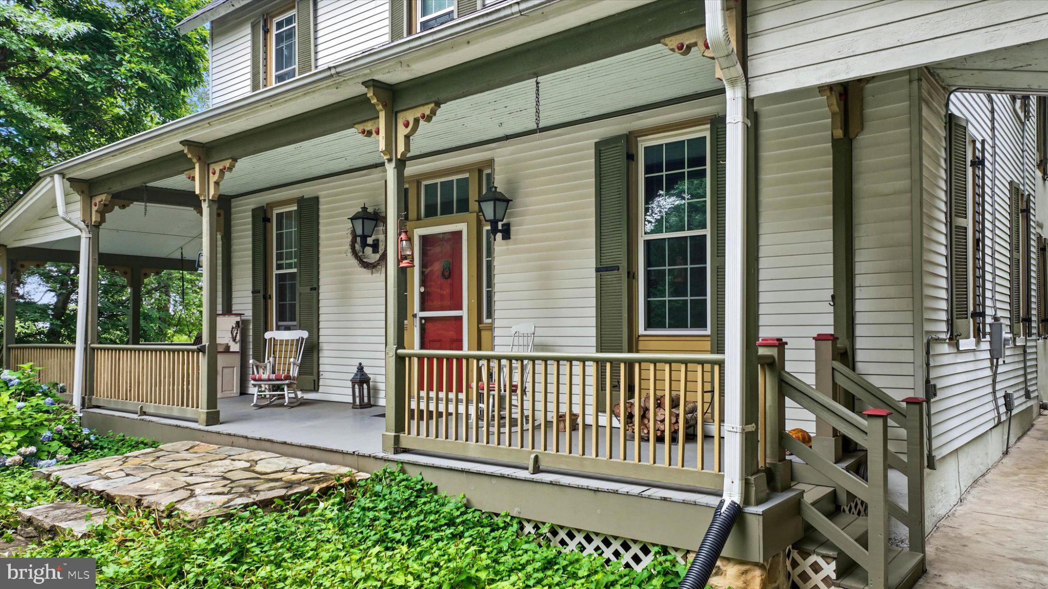 6739 South Clifton Road Frederick, MD 21703 - Photo 49 of 53 Charming porch with lush greenery.