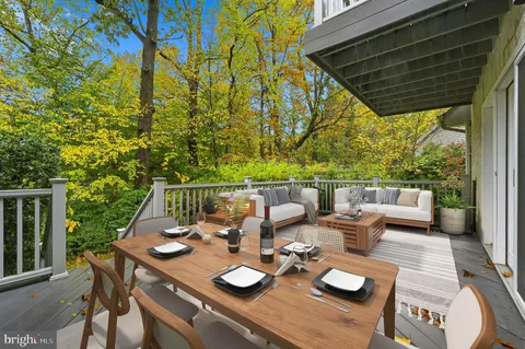 a view of deck and patio with furniture