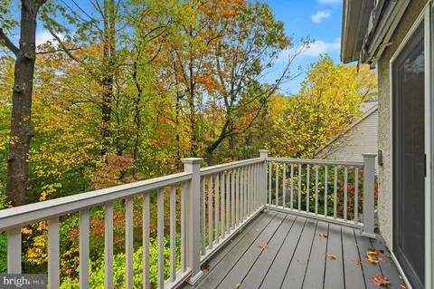 a view of balcony with wooden floor