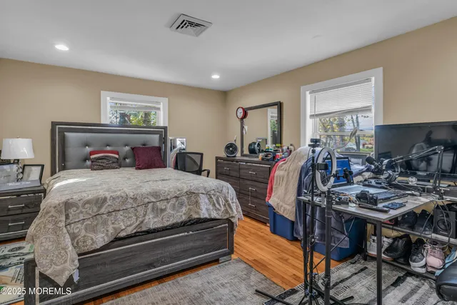 a bedroom with furniture and a window
