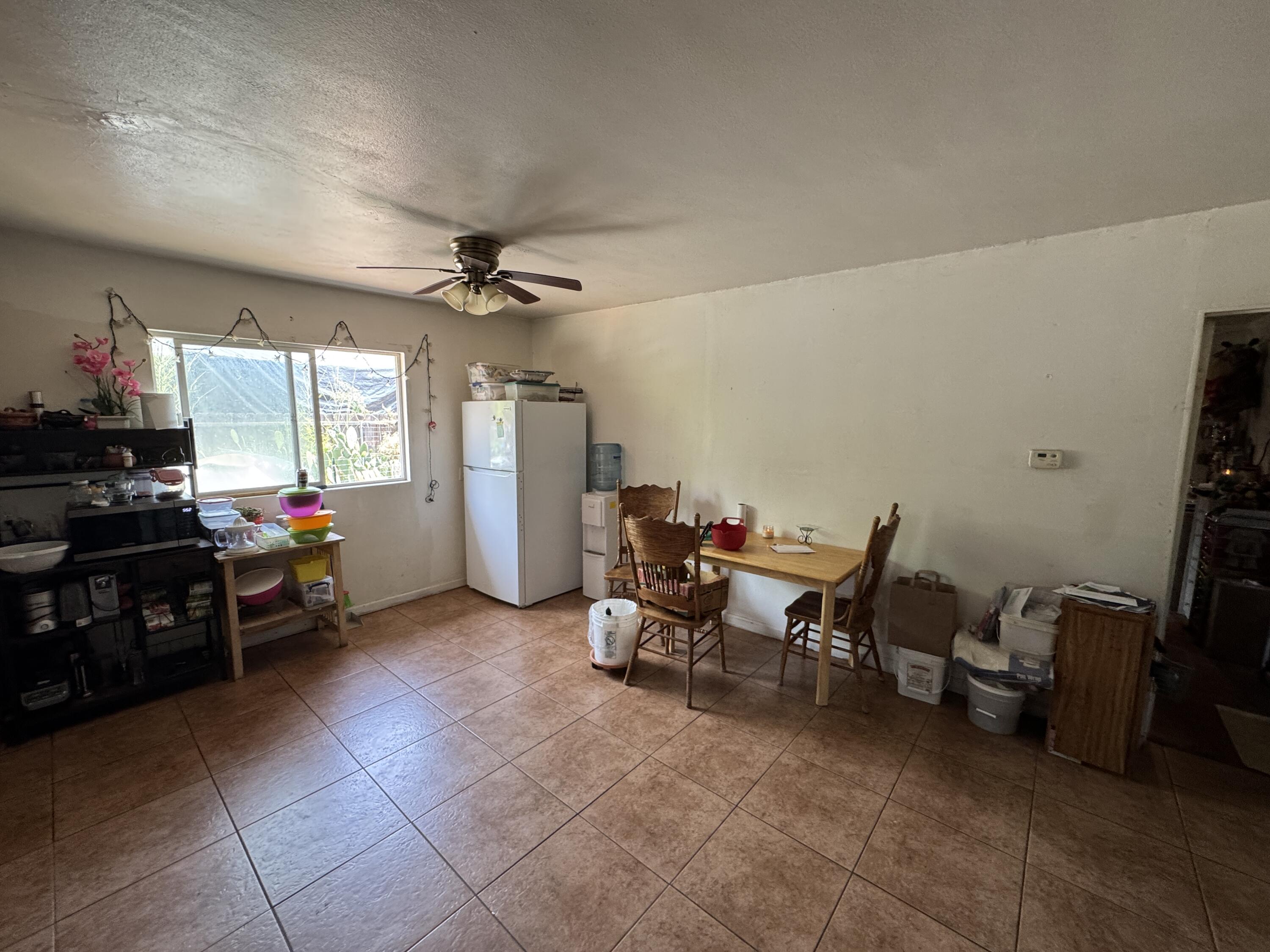 704 North Floral Street Visalia, CA 93291 - Photo 11 of 51 a view of a workspace with furniture and a kitchen