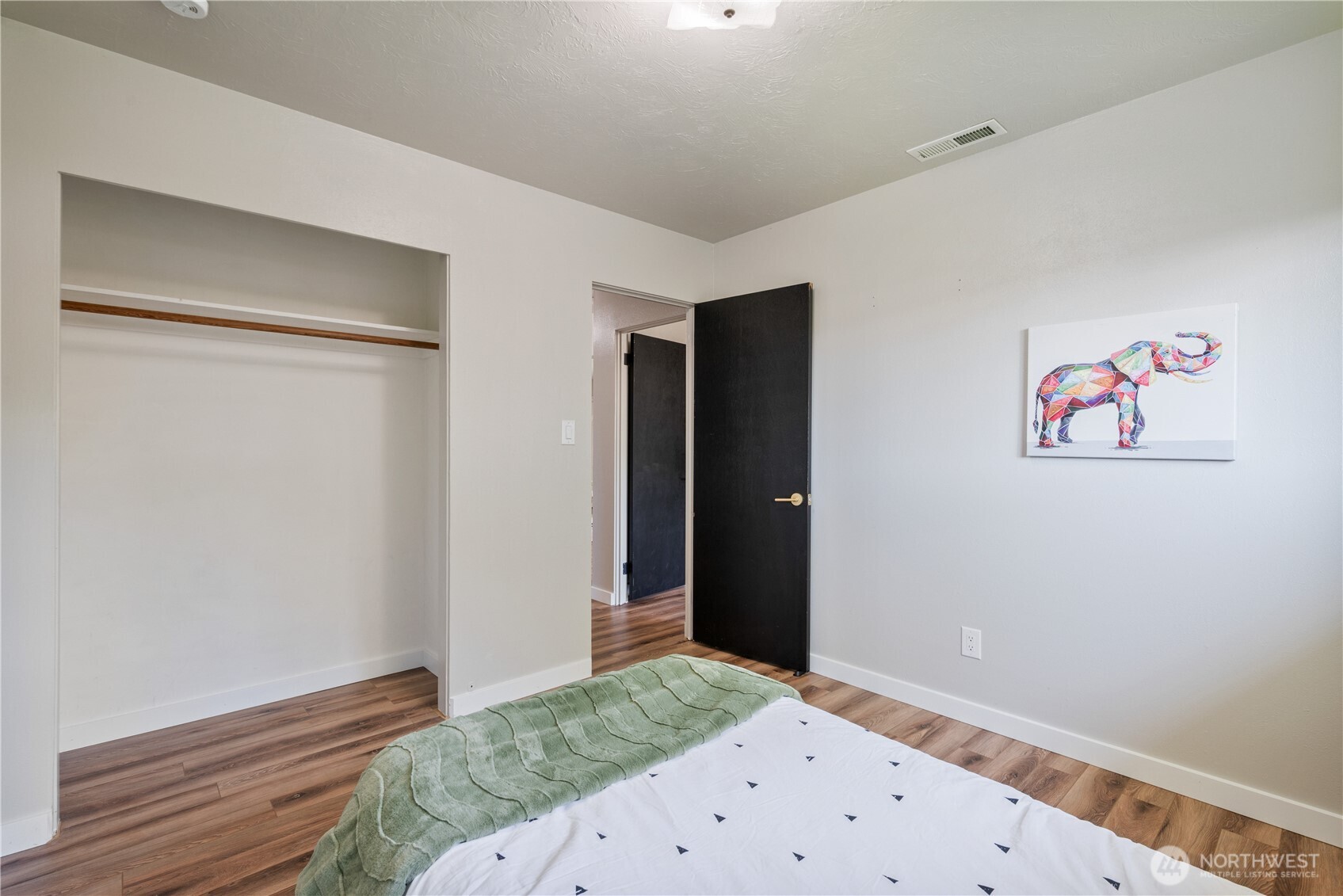 2943 Magnolia Street Longview, WA 98632 - Photo 20 of 36 a bedroom with a bed and wooden floor