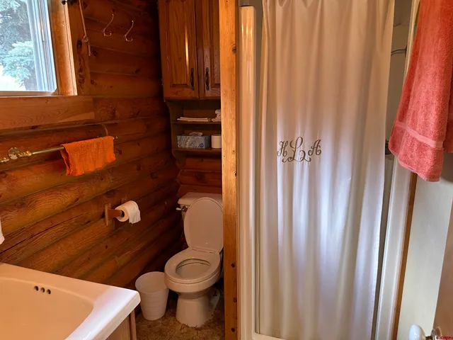 a bathroom with a toilet and a sink