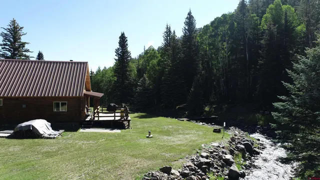 a view of a chair and table in the garden