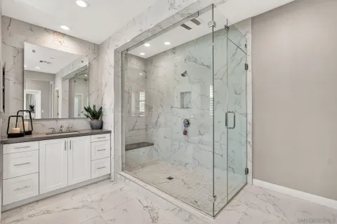 a bathroom with a sink toilet and shower
