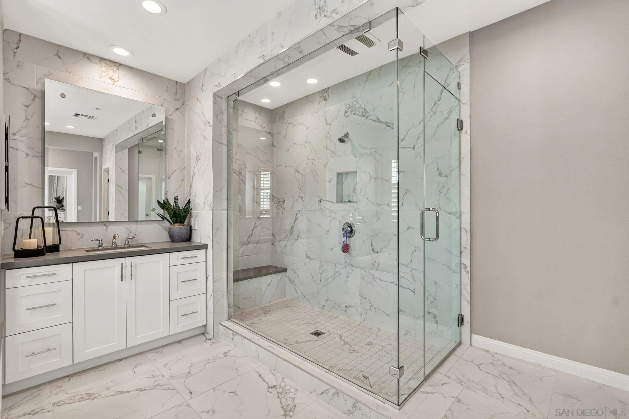 21509 Wilgen Road Escondido, CA 92029 - Photo 23 of 37 a bathroom with a shower sink and mirror