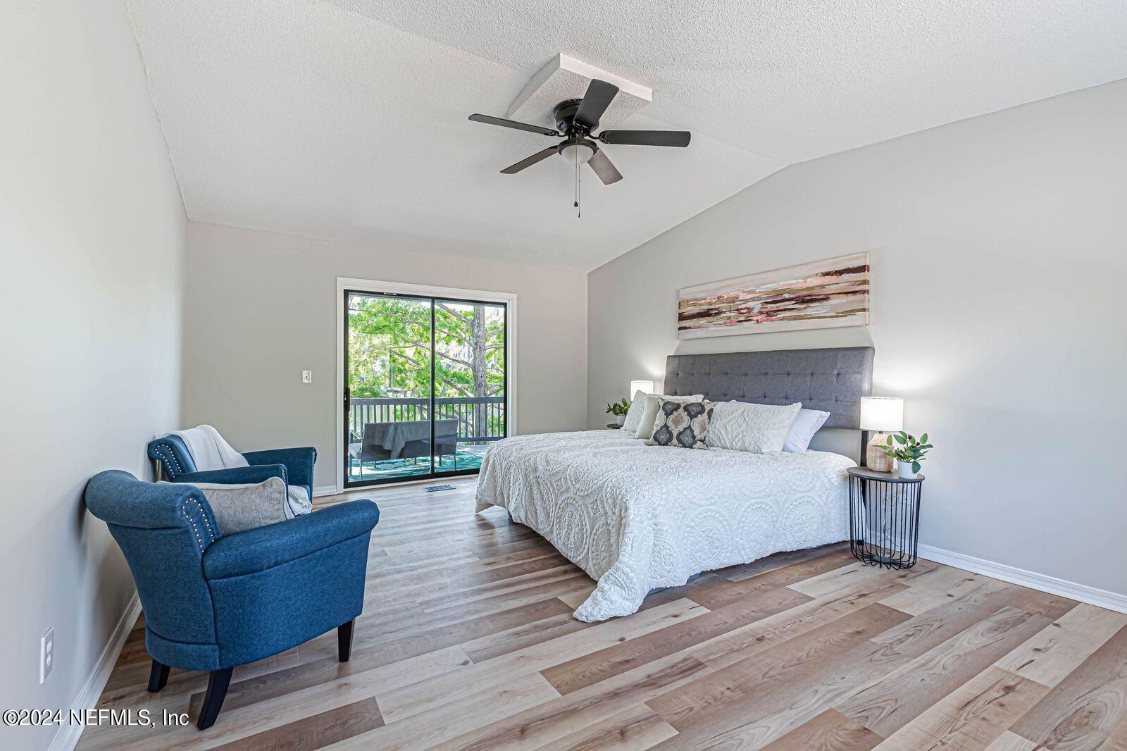 565 Roberts Road St. Johns, FL 32259 - Photo 26 of 79 a spacious bedroom with a bed and a couch