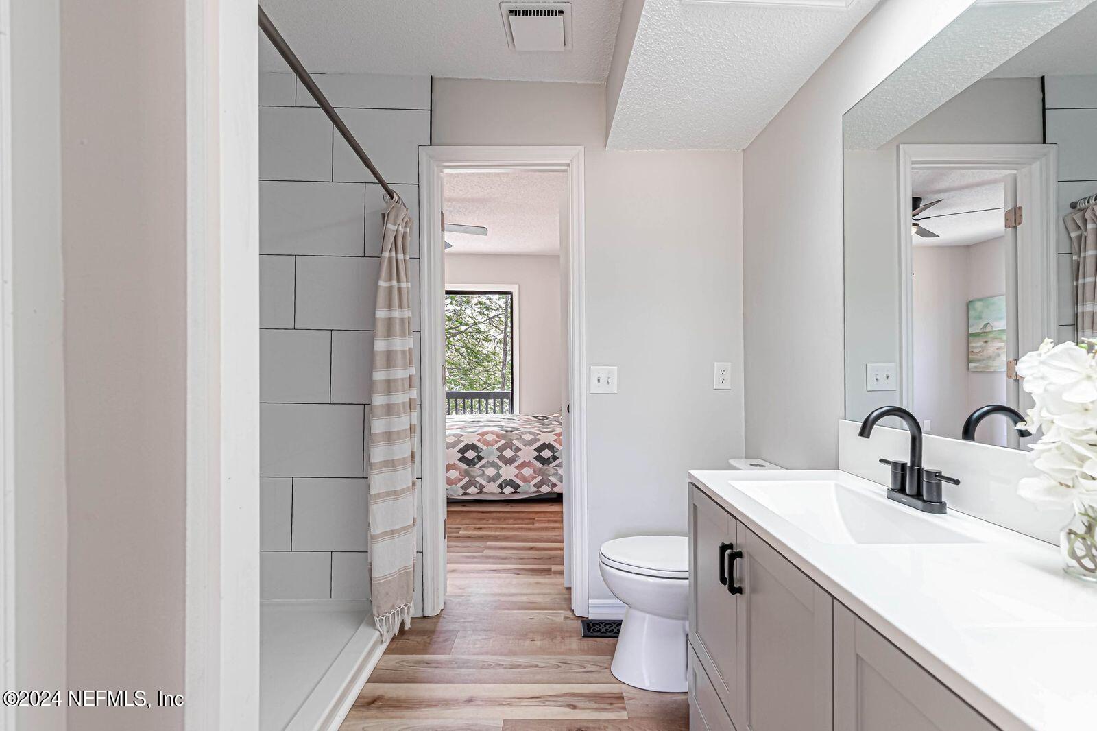 565 Roberts Road St. Johns, FL 32259 - Photo 38 of 79 a bathroom with a sink toilet and shower
