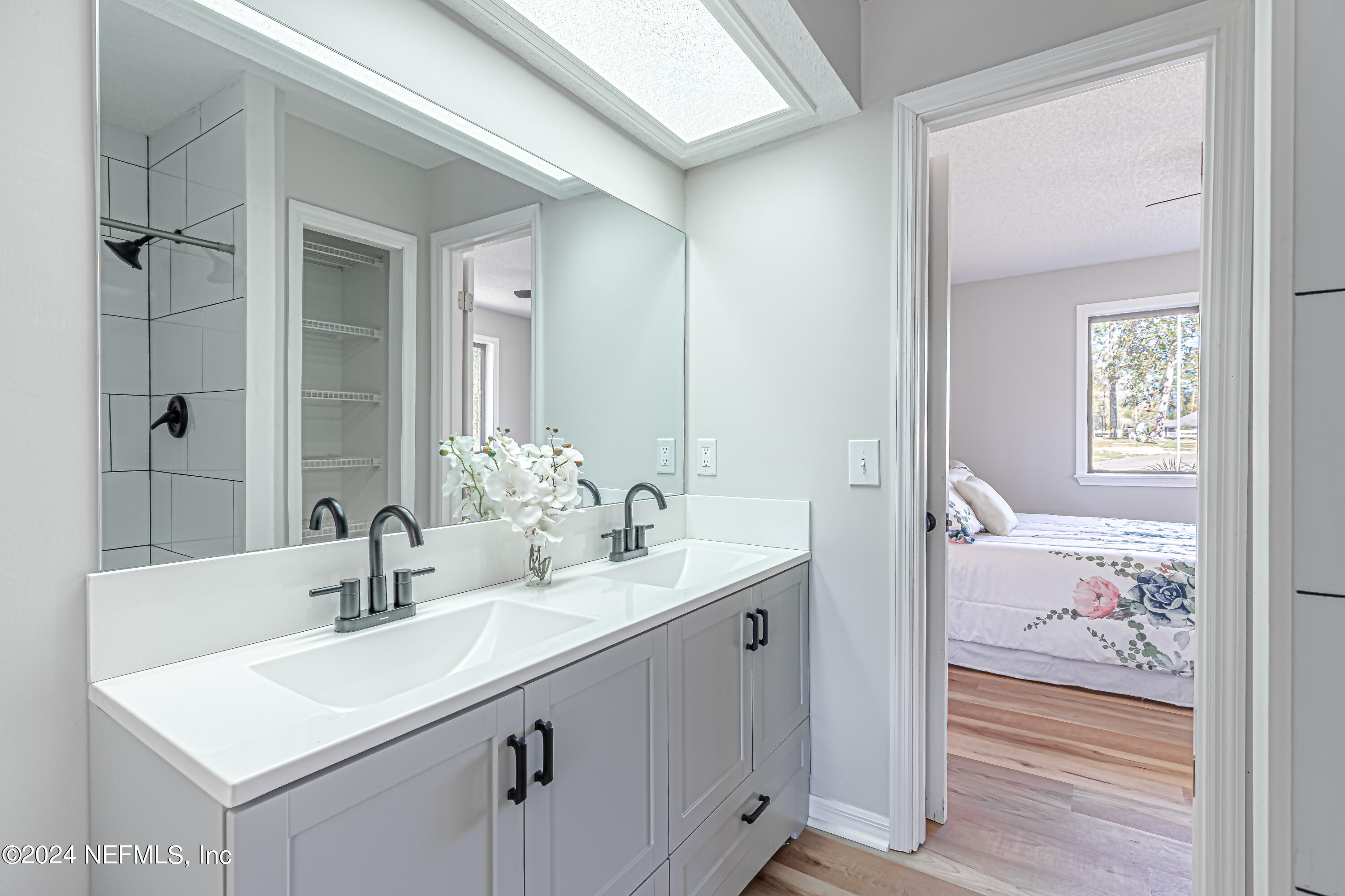565 Roberts Road St. Johns, FL 32259 - Photo 39 of 79 a bathroom with a sink and a mirror