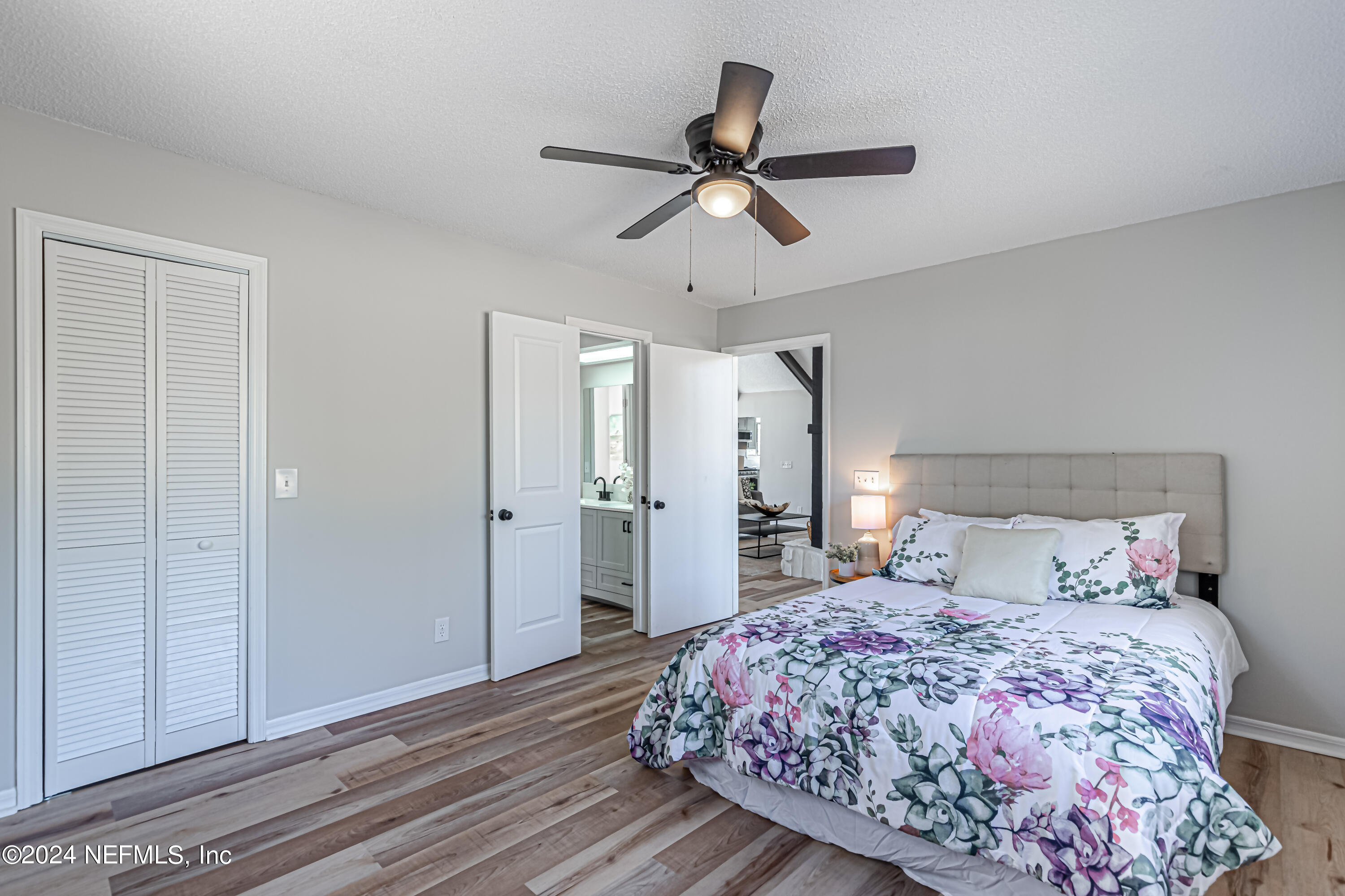 565 Roberts Road St. Johns, FL 32259 - Photo 42 of 79 a bedroom with a bed and a ceiling fan
