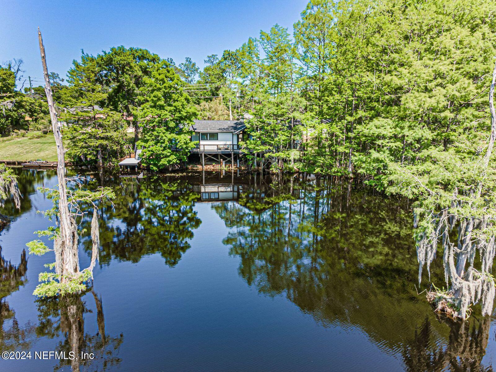 565 Roberts Road St. Johns, FL 32259 - Photo 60 of 79 a view of a lake with a house in background