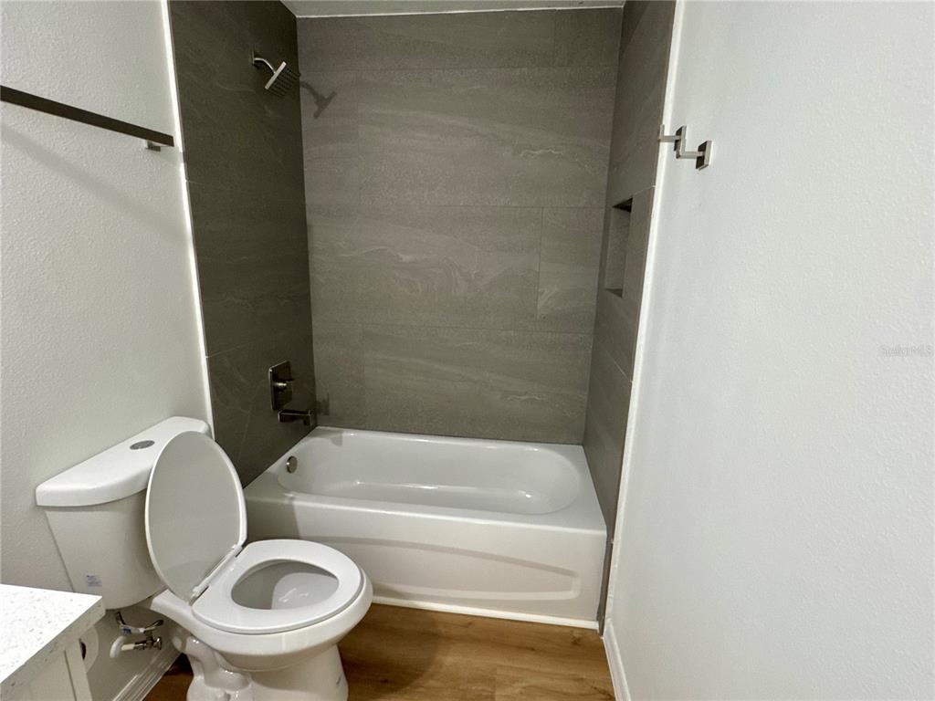 8601 North Stern Drive Citrus Springs, FL 34434 - Photo 13 of 18 a bathroom with a toilet and a bathtub