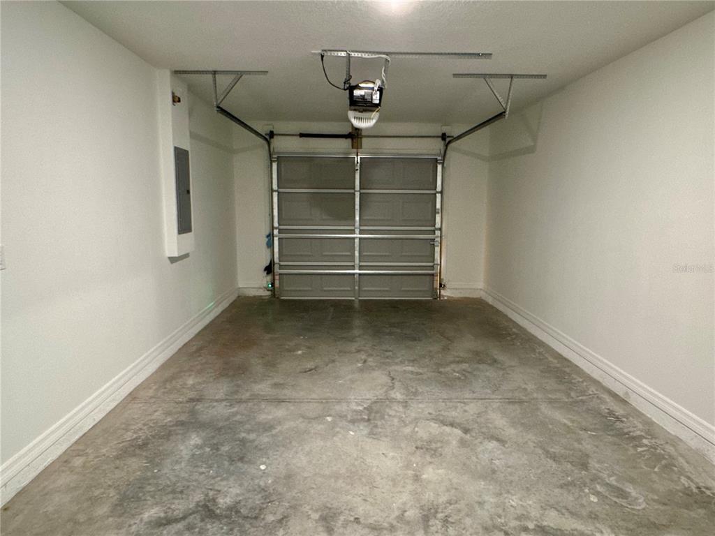 8601 North Stern Drive Citrus Springs, FL 34434 - Photo 16 of 18 a view of room with stairs and a window