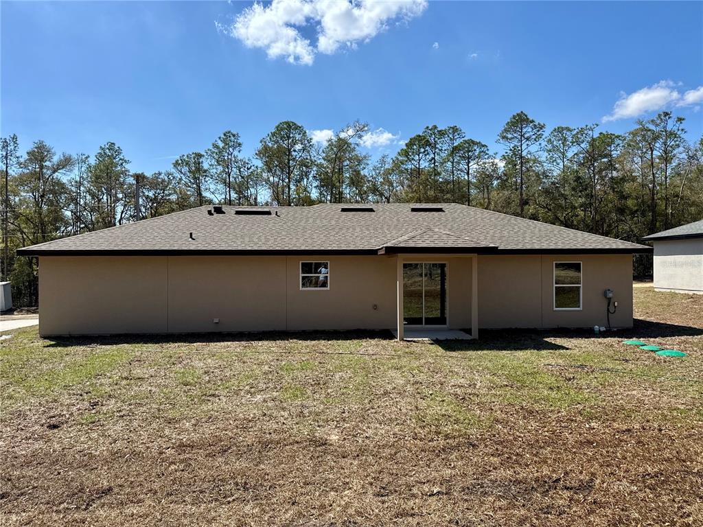 8601 North Stern Drive Citrus Springs, FL 34434 - Photo 18 of 18 a backyard of a house