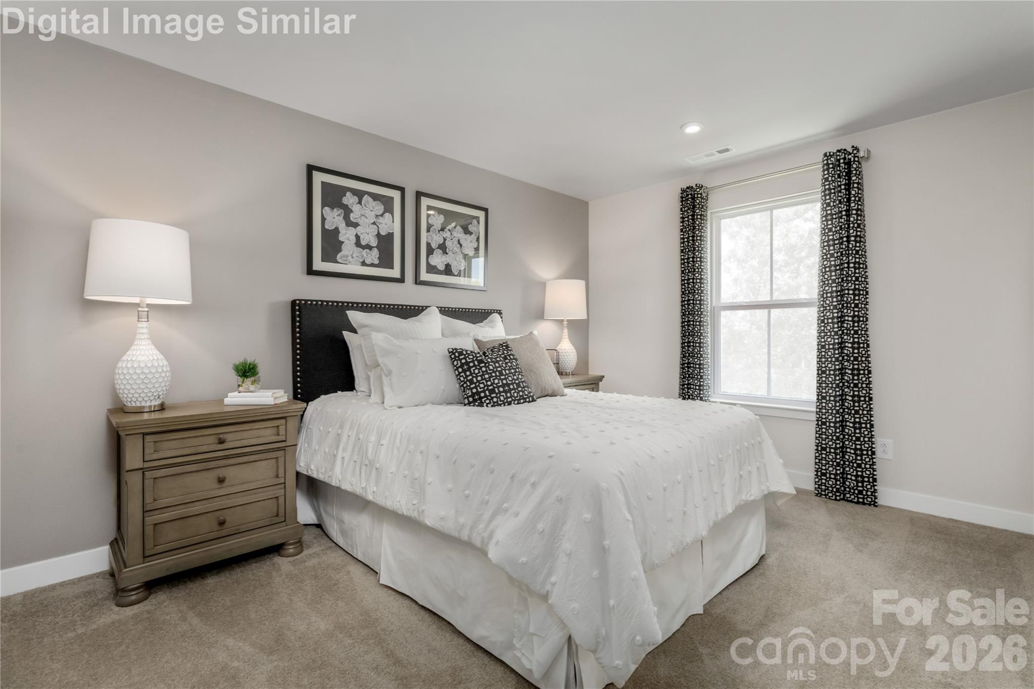 9569 Teamwork Street Northwest Concord, NC 28027 - Photo 12 of 23 a bedroom with a bed and a window