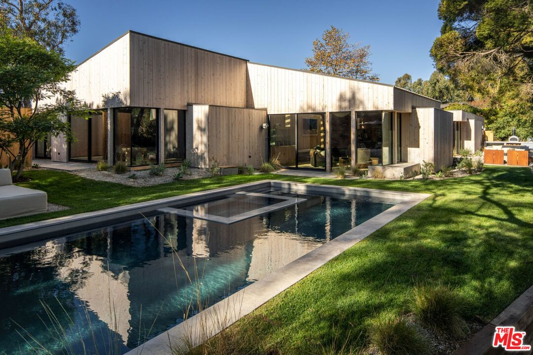 a view of swimming pool with patio
