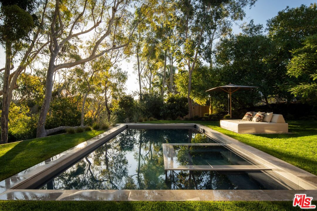 28779 Sea Ranch Way Malibu, CA 90265 - Photo 18 of 23 a view of a swimming pool with a patio and fire pit
