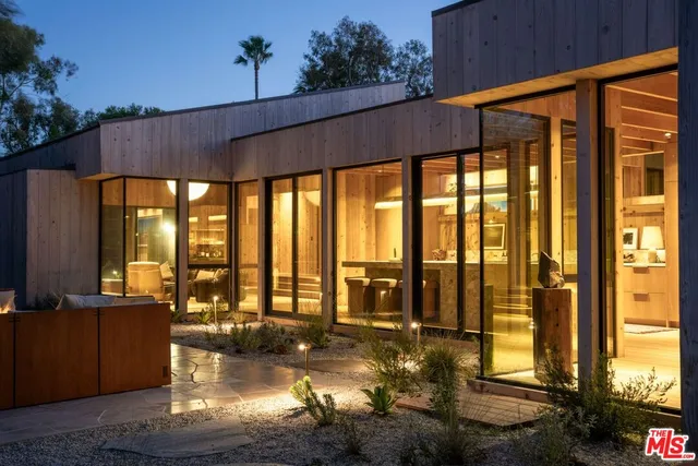 a view of a swimming pool with an outdoor seating