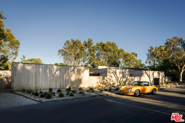 a view of a cars park on side of road